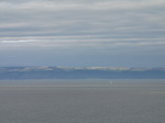 SX08282  Sailboat at Devon coastline taken across bay from Ogmore by Sea semi wide angle.jpg